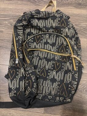 Black and Gold Backpack for everyday travel or overnight Bag